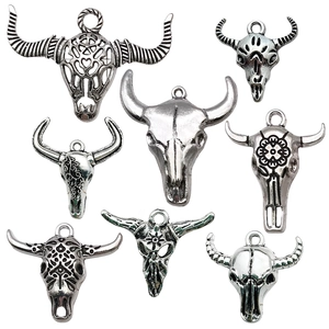 Set of 8 antique silver bull skull pendants with bohemian tribal carvings and loops