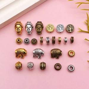 Vue détaillée de perles d'espacement en alliage d'or, argent et bronze pour bracelets DIY