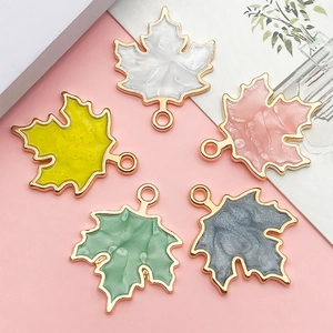 Five multicolor pearlescent maple leaf charms with gold trim for DIY jewelry making