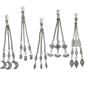 Five vintage silver alloy tassel pendants with moon and flower motifs for DIY jewelry making