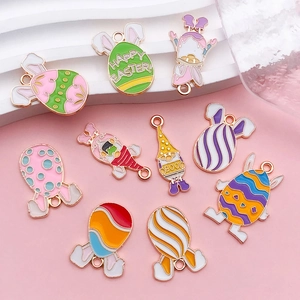 Detailed view of colorful enamel Easter charms with rabbit and egg designs for DIY jewelry