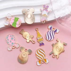 Detailed view of colorful enamel Easter egg pendants and cute bunny charms for DIY jewelry