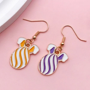 Detail of Easter bunny enamel pendants with colorful stripes and gold-plated alloy hooks