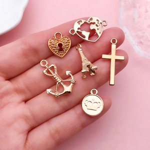 DIY rose gold jewelry pendants including Eiffel Tower, heart, and crown for handmade crafts