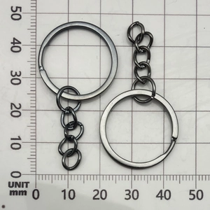 Top view of gun-black metal keychain rings with a 4-link chain measured on a scale