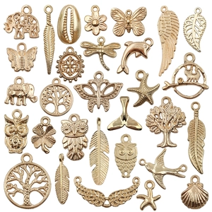 Mix of gold-plated animal and plant pendants including owl and butterfly for DIY jewelry