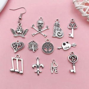 Detailed view of assorted antique silver alloy charms for DIY jewelry making and crafts
