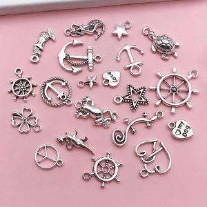 Detailed view of antique silver marine life alloy charms for DIY jewelry making