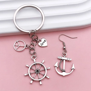 Antique silver nautical jewelry set with anchor earrings and helm heart keychain charm
