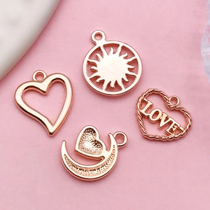 Rose gold alloy pendant set with hollow heart, sun, moon and LOVE charms for DIY jewelry