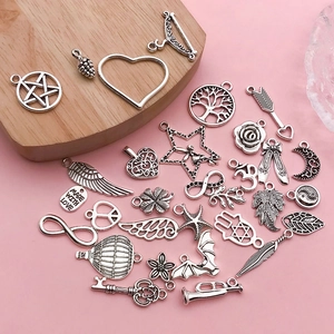 Assorted vintage silver alloy charms featuring angel wings and hot air balloon motifs