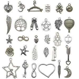 Set of 27 antique silver alloy charms for DIY jewelry making featuring various vintage shapes