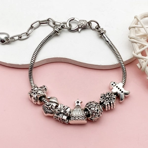 Bracciale natalizio con catena a serpente d'argento, Babbo Natale e ciondolo a fiocco