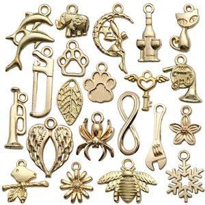 Golden alloy vintage charms set featuring animals plants and symbols for DIY jewelry making