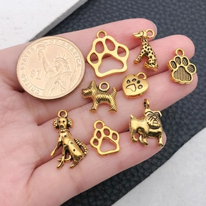Golden alloy dog charms set for DIY jewelry with variety of puppy breeds and paw prints