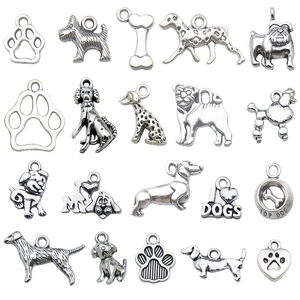 Set of 20 vintage silver alloy dog pendants featuring breeds, bones, and paw prints
