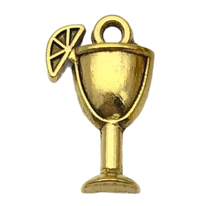 Macro detail of a cocktail glass charm in antique gold alloy for DIY jewelry making