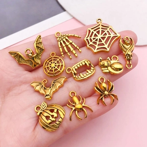 Golden Halloween alloy charm set featuring bats, spiders, and pumpkins for DIY jewelry making