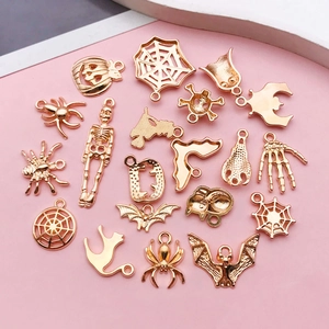 Golden Halloween charms set featuring ghosts, spiders and pumpkins for DIY jewelry making