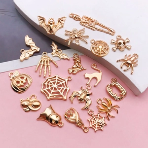 Detailed set of gold plated Halloween charms including pumpkin and spider for DIY jewelry