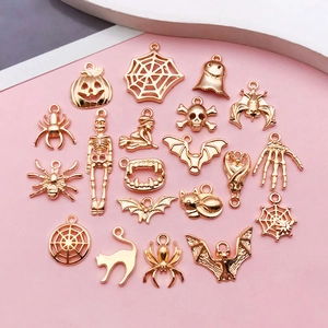 Detailed set of 21 gold alloy Halloween charms including pumpkin, ghost and bat motifs