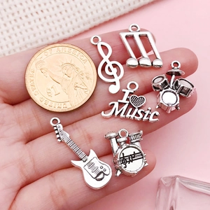 Vintage silver music charms set including guitar and notes for DIY jewelry making