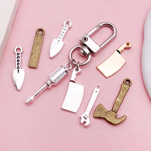 Assorted alloy tool charms set including axes and wrenches in gold, silver, and bronze finishes