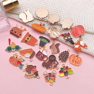 Variety of Thanksgiving enamel charms featuring pumpkin, turkey, and squirrel designs