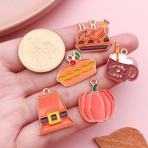 Thanksgiving enamel alloy pendant charms with pumpkin turkey and pie on pink background