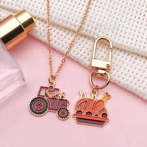 Thanksgiving enamel tractor necklace and turkey keychain set with golden alloy finish