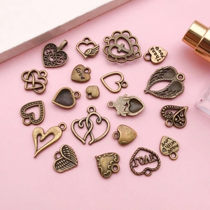 Antique bronze heart pendants with love engravings for DIY jewelry making and crafts