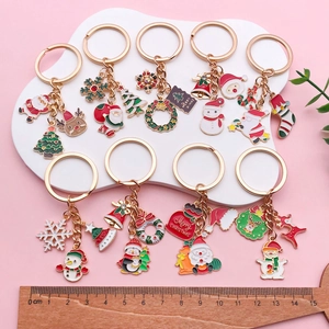 Christmas enamel keychain set featuring Santa, reindeer and snowman pendants with gold alloy