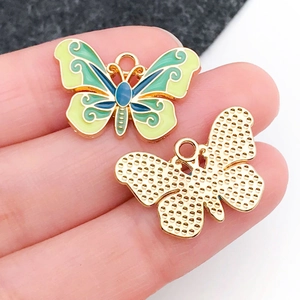 Detailed close-up of colorful butterfly charm with blue and green enamel texture