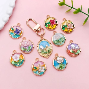 Floral enamel tulip charms set with gold plating and pearl details for DIY jewelry making