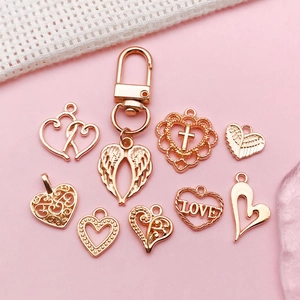 DIY rose gold heart and wing charms set for jewelry making including lobster clasp pendants