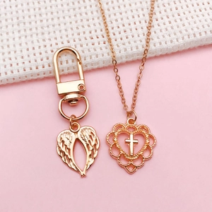 Rose gold angel wing keychain and heart cross pendant necklace set with detailed engraving