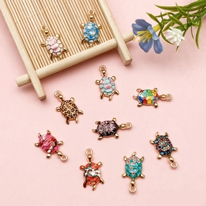 Set of ten colorful sea turtle alloy pendants with enamel floral and leopard print patterns
