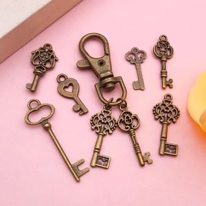 Assorted vintage bronze key charms with heart patterns and lobster clasps for DIY jewelry