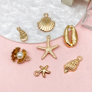 Set de pendentifs dorés thème océan avec étoile de mer et coquillage pour bijoux DIY
