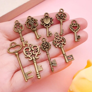 Detailed view of bronze vintage style key charms for DIY jewelry making and pendants