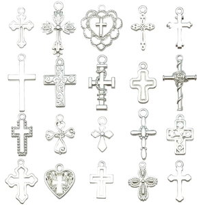 Set of 20 assorted bright silver cross pendants in various vintage and floral metal styles
