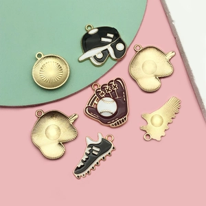 Detailed close-up of baseball themed enamel charms featuring glove, hat and shoe shapes