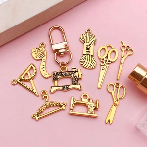 Detailed set of antique gold sewing-themed DIY pendants including machine and scissors