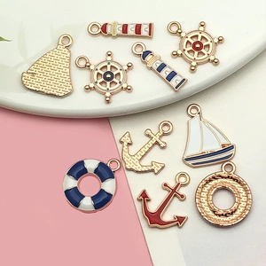 DIY nautical alloy charms set featuring anchors and lighthouses with gold finish enamel