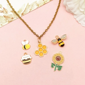 Ensemble de pendentifs abeille et tournesol avec chaîne en bronze et émail