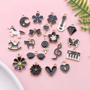 DIY black enamel charms set with moon, unicorn, and music notes for jewelry making