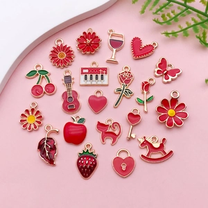 Assorted red enamel fruit and flower charms for DIY jewelry making with gold-tone plating