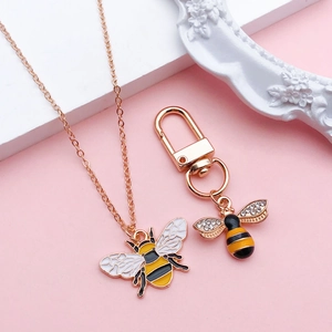 Rose gold honey bee necklace and keychain set with enamel wings and rhinestone accents