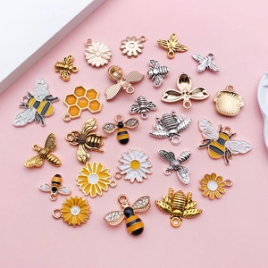 Assorted honeybee and daisy alloy pendants for DIY jewelry making in gold finish