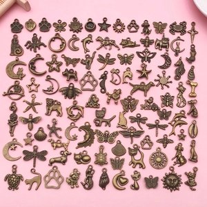 Assorted vintage bronze alloy charms featuring animals, sun, and moon for DIY jewelry making